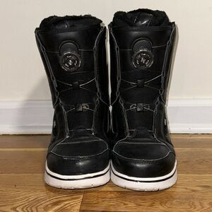 Snowboard boots by Vans. Helmet by Smith.